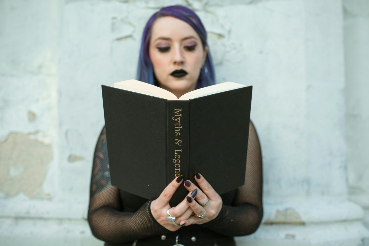 Close-Up Shot of a Woman Holding a Book