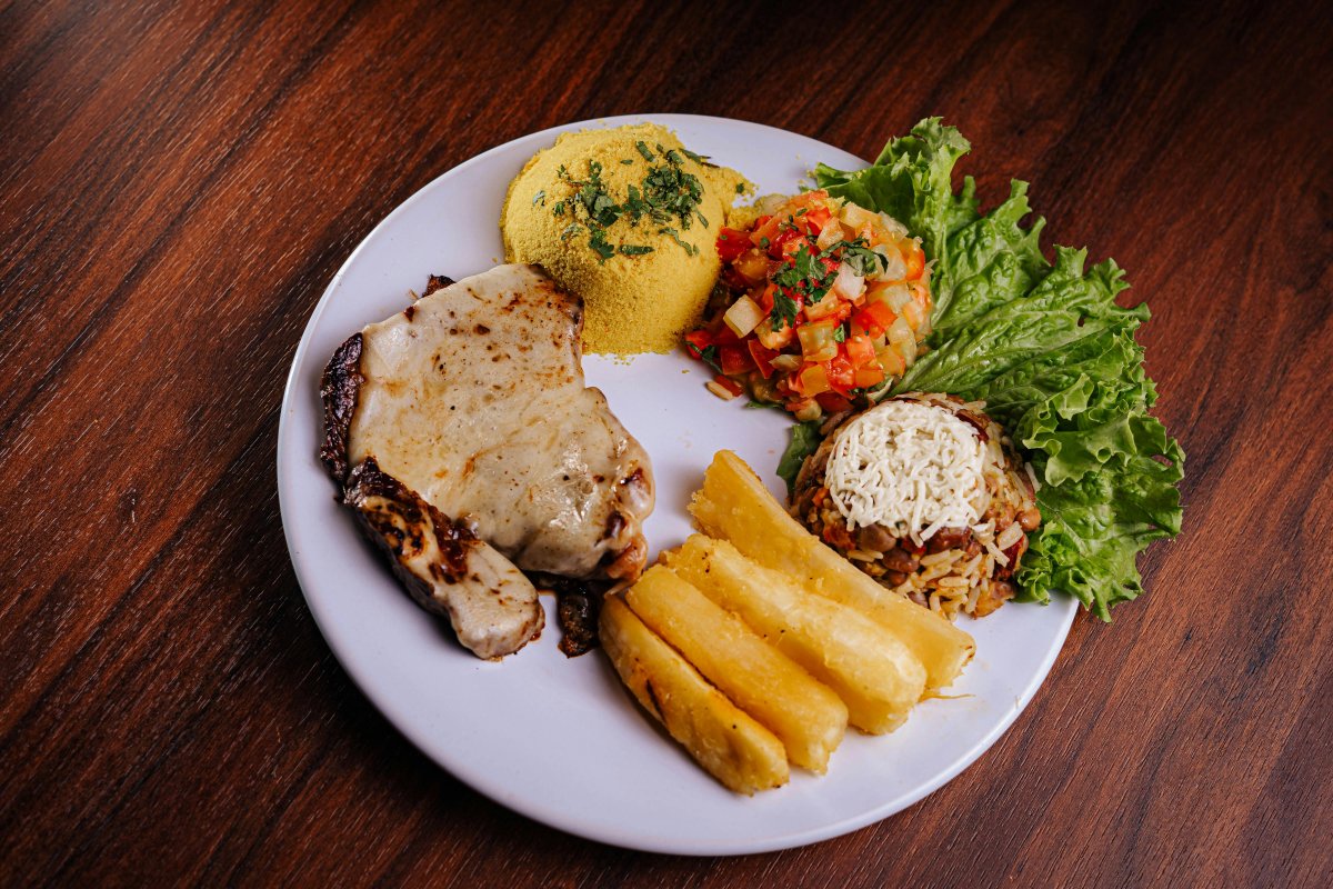 Varied Brazilian Cuisine on Wooden Table