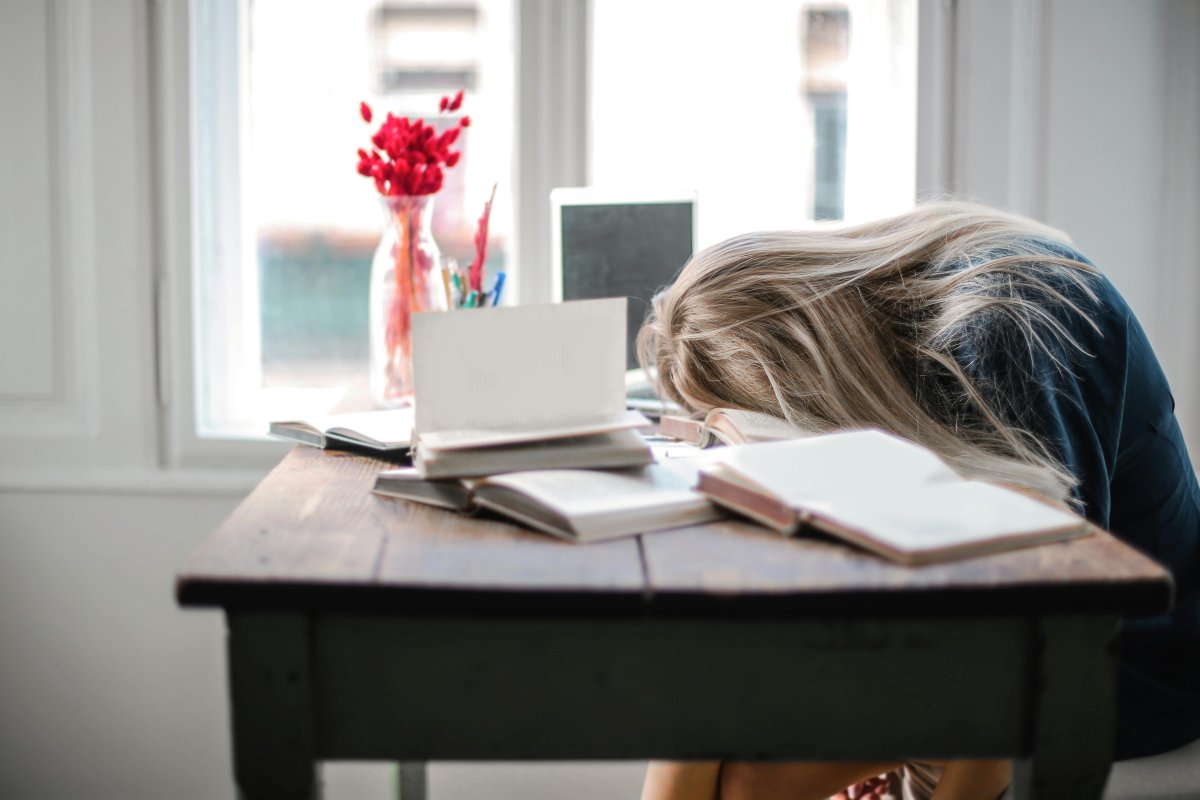 Woman Sleeping on Her Desk