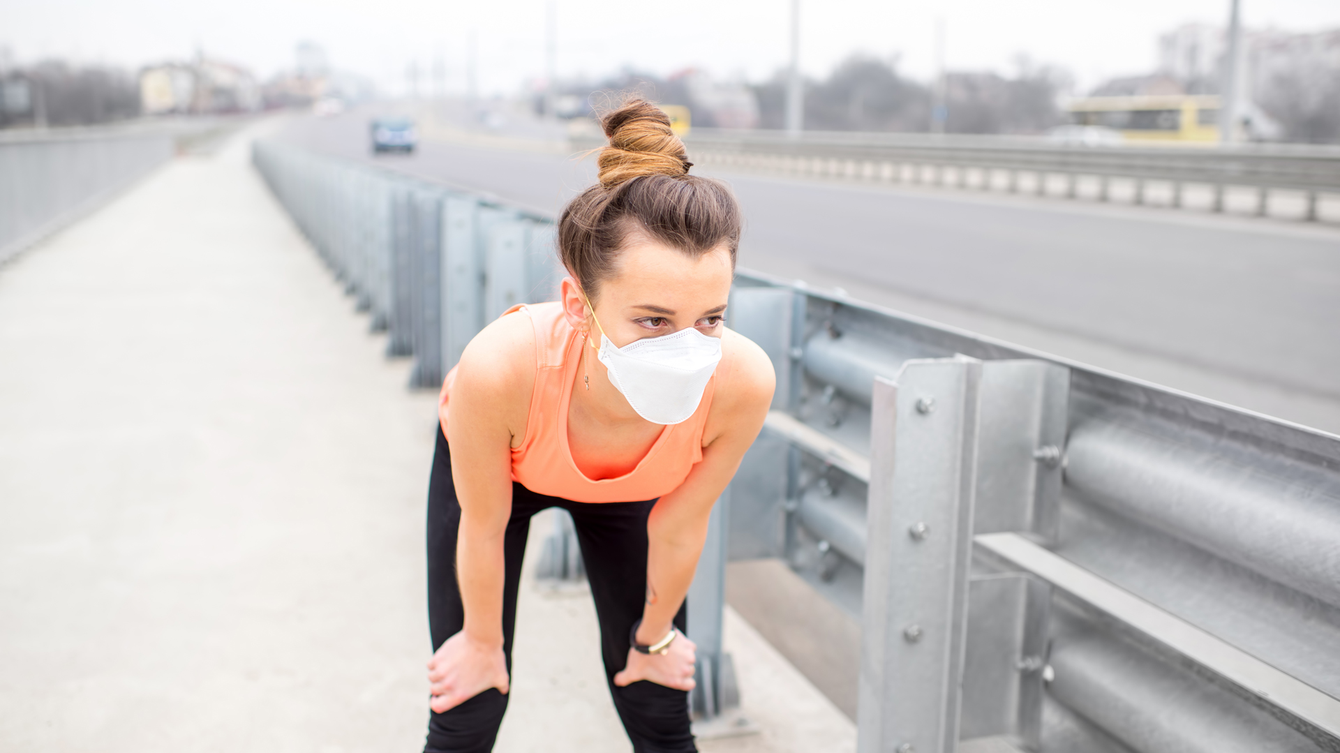 Woman exercising with protective mask